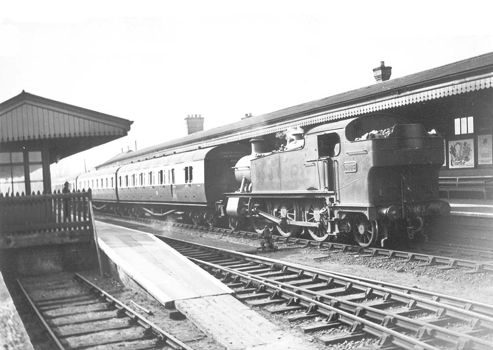 Ex-GWR 2-6-2T Large Prairie No 5163 is seen running bunker first at the head of a Snow Hill to Leamington local passenger service 