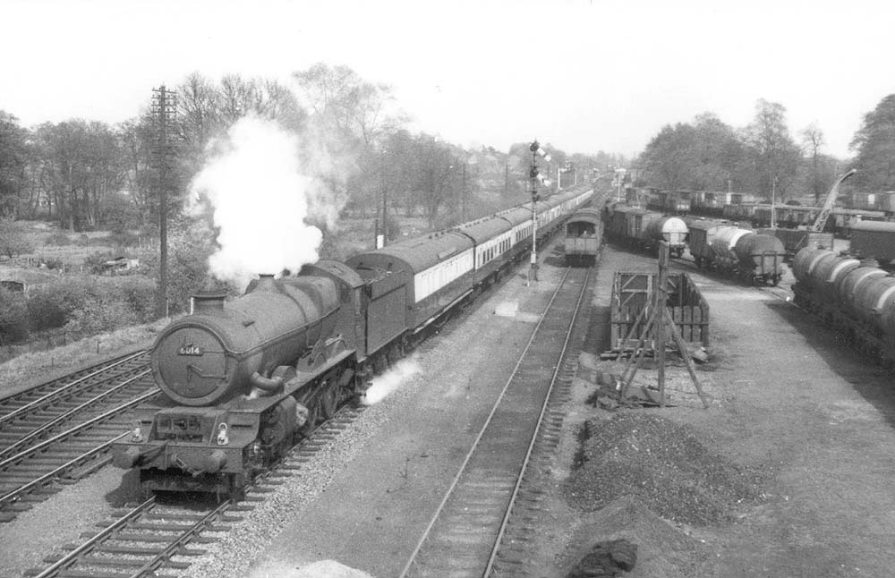 Ex-GWR 4-6-0 King class No 6014 'King Henry VII' is seen with plenty of steam as it starts to tackle Hatton Bank with a down express