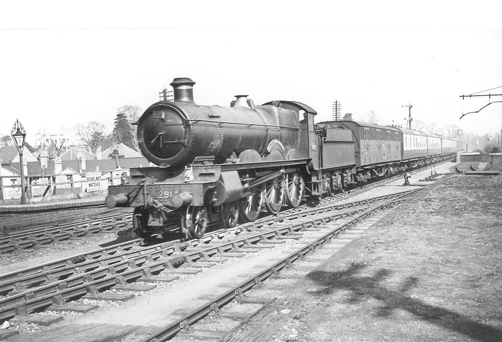 GWR 4-6-0 29xx Class No 2914 'Saint Augustine' is seen at the head of a down express service with a Siphon vehicle behind the tender