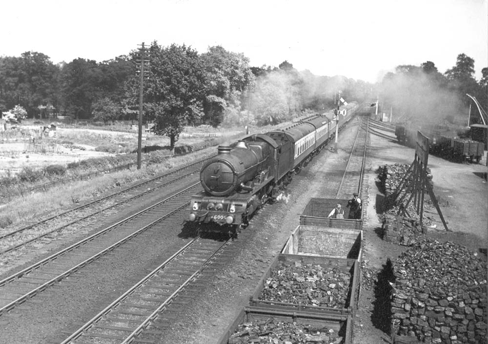 GWR 4-6-0 King class No 6005 'King George II' is working hard at the head of a named express service as it passes Cape Yard