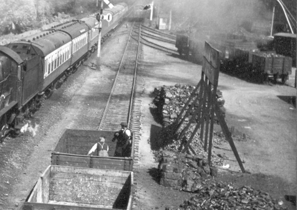 Close up showing workmen in the process of unloading coal prior to stacking the coal on the ground circa 1938