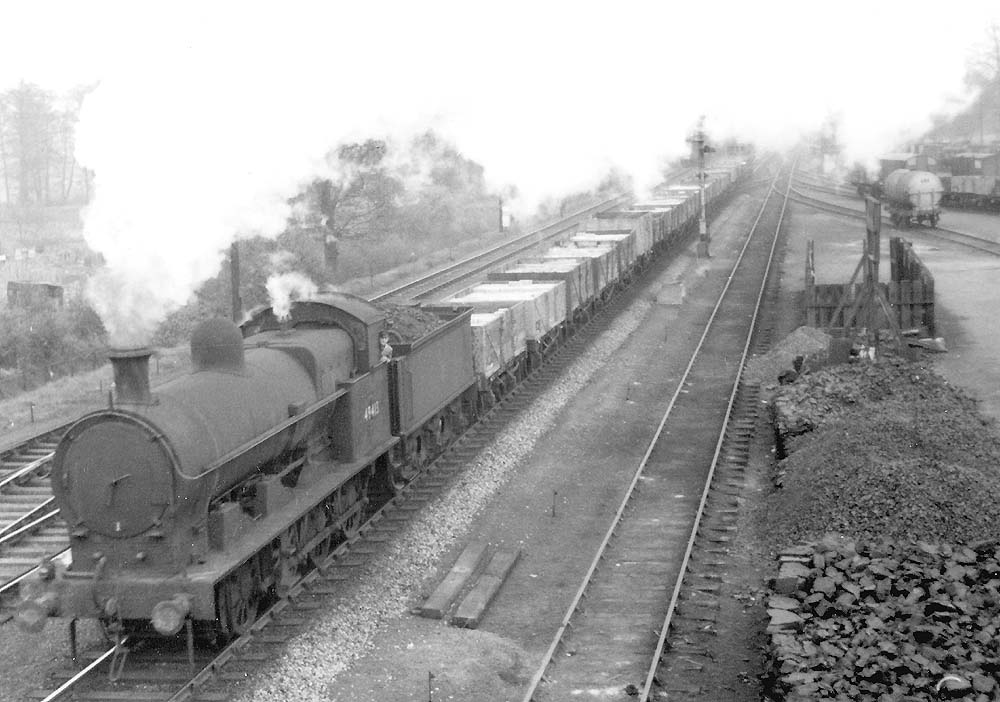 Ex-LNWR 0-8-0 'G2 class' No 49413 is seen at the head of stopping freight train as it passes Cape Yard, with no banker to the rear