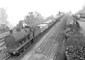 Ex-LNWR 0-8-0 'G2 class' No 49413 is seen at the head of stopping freight train as it passes Cape Yard