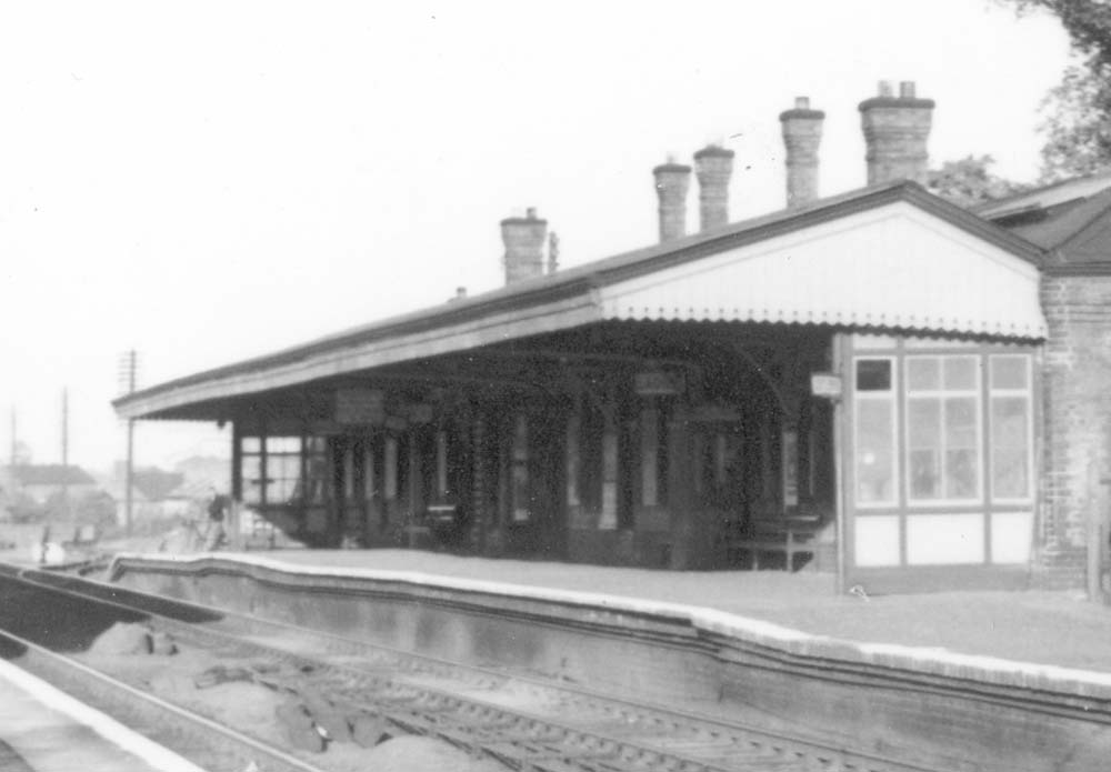 Close up showing the various phases of building reflected by the different platform levels of the down platform