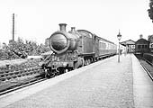 GWR 2-6-2T Prairie Tank No 3162 stands in the station on a down local train made up with Clerestory coaches