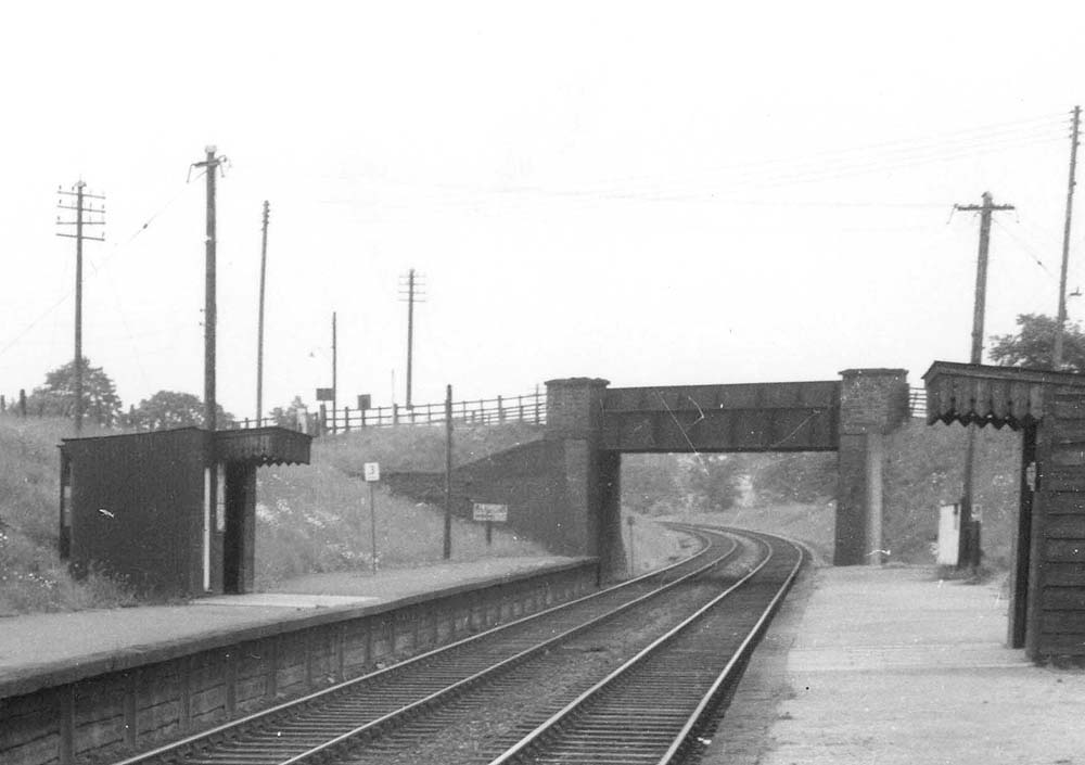 Close up showing the small ticket office located on the up platform on the left next to the shelter