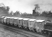 Close up of the GWR 2-6-0 Aberdare locomotive heading south with a train comprising a large number of Greaves Cement Vans