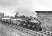 Ex-GWR 4-6-0 Castle Class No 5034 'Corfe Castle' is seen near Harbury on an express service on 9th February 1952
