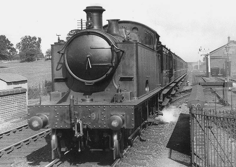 GWR 2-6-2T  No 3913 is seen at the head of a Birmingham to Leamington local passenger service as it passes over Widney Lane bridge