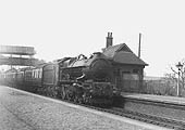 GWR 4-6-0 No 6017 'King Edward IV' is seen at the head of an up Birkenhead to Paddington express as it passes through the original station