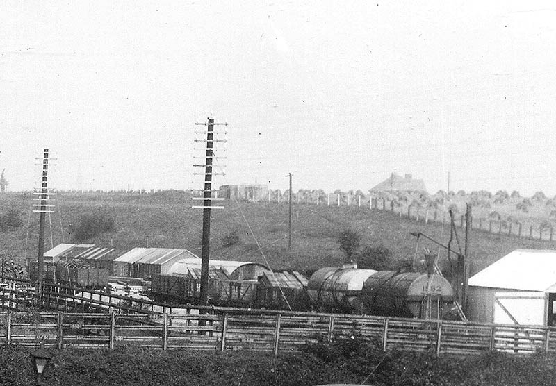 Close up showing the goods siding which has been utilised by the contractor to bring in material and fuel together with providing office accommodation