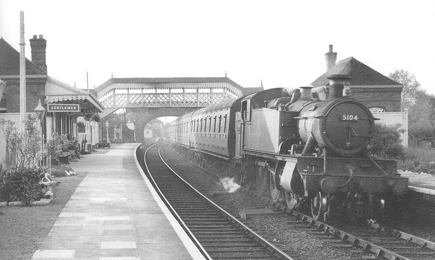Ex-GWR 2-6-2T No 5104 enters the station with the 6:40pm Birmingham Moor Street to Stratford on Avon service on 28th May 1957