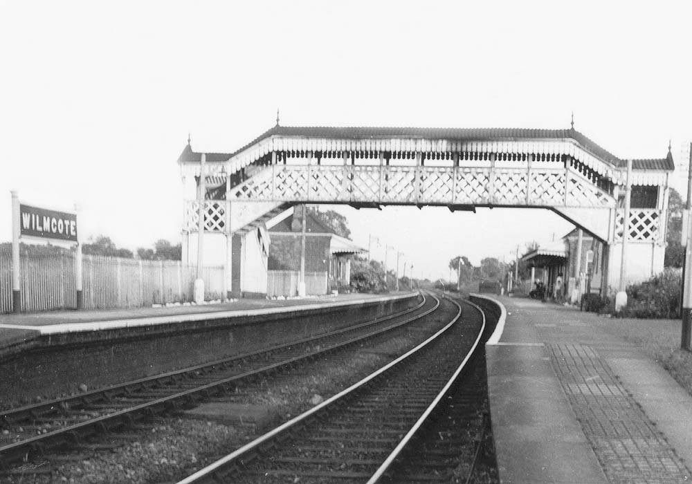 Looking towards Stratford upon Avon with a freight service standing in the refuge siding in the distance on the right whilst the up main line signal is in the off position