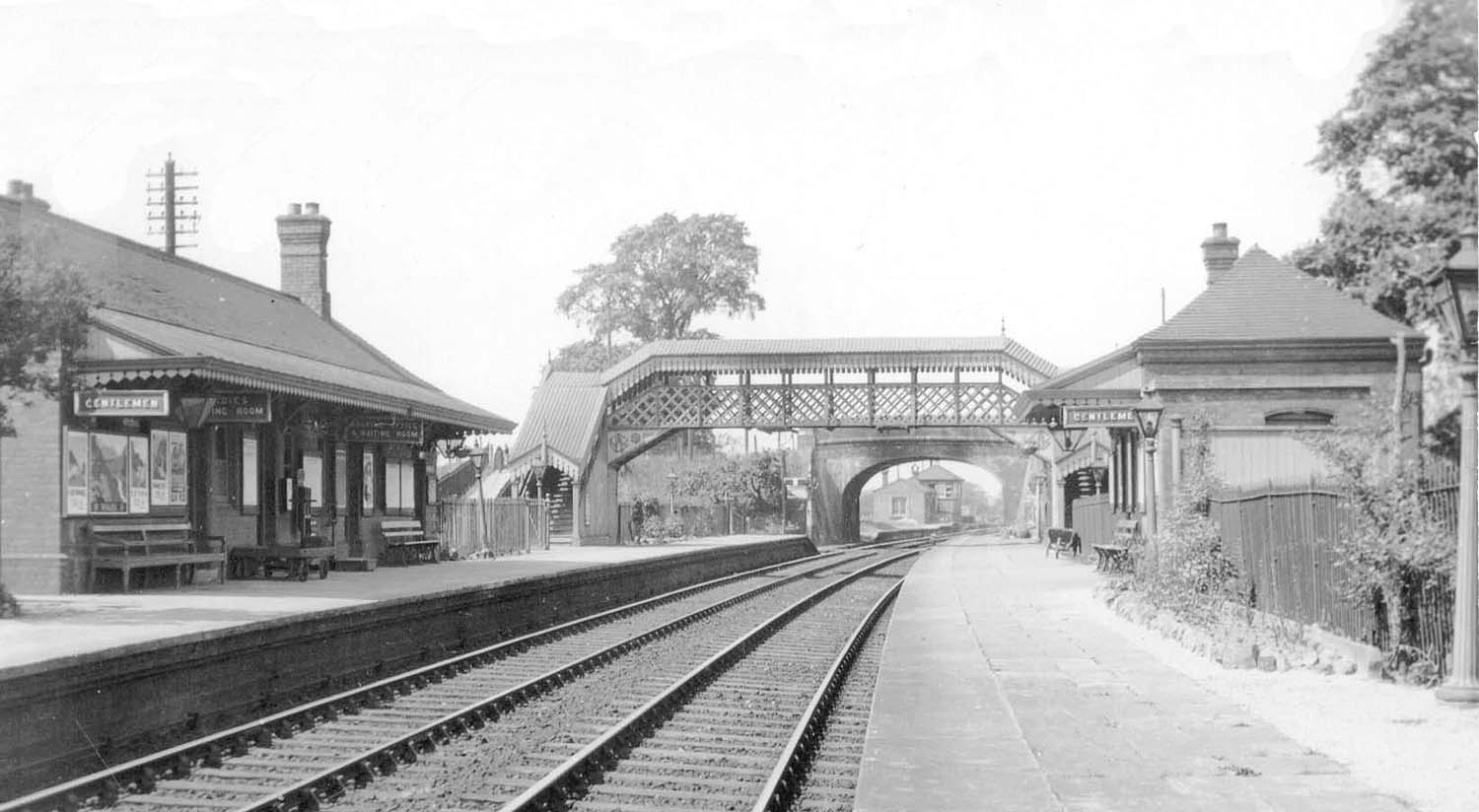 Looking towards Birmingham showing the up platform on the left and the new steel framed covered passenger footbridge just beyond the buildings