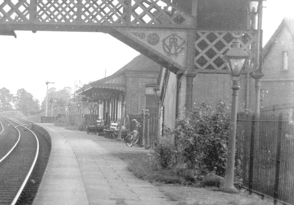 Close up looking along Wilmcote station's up platform showing the refuge siding located at the Stratford upon Avon end of the platform