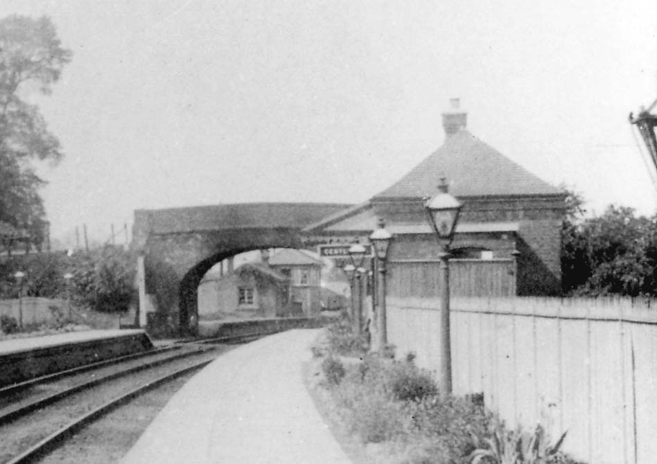 Close up showing the original 1860 station under the arch and the smaller down platform building with the gentlemens toilet nearest the camera