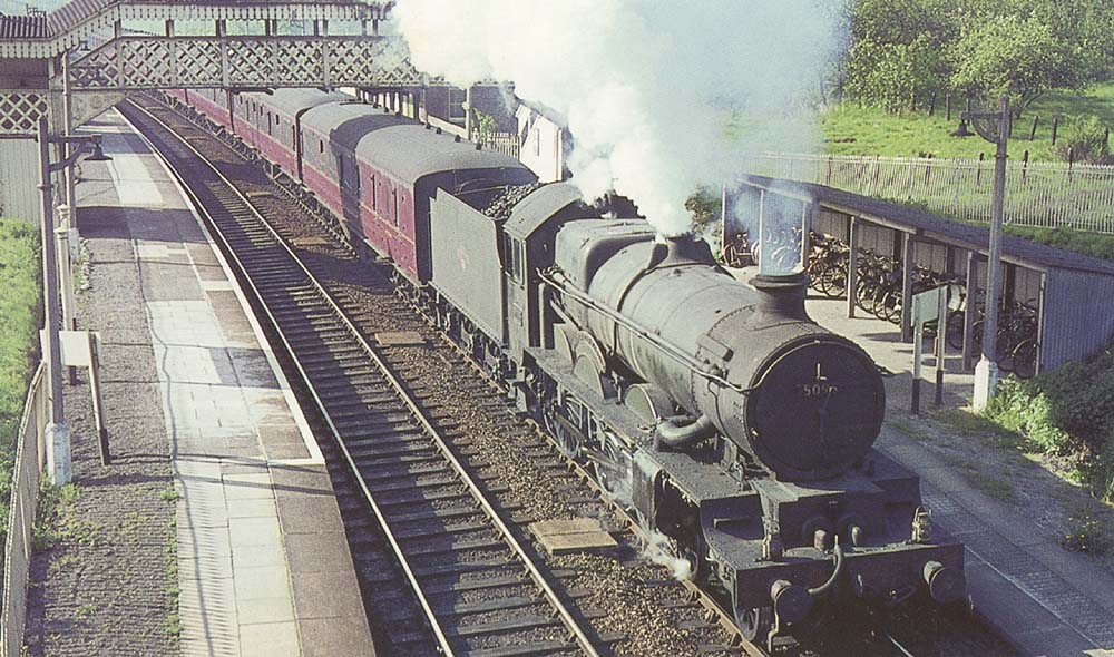 Ex-GWR 4-6-0 Castle class No 5096 'Bridgewater Castle' is seen relegated to much lowly duties as it heads the 8:32 am Stratford on Avon to Snow Hill service