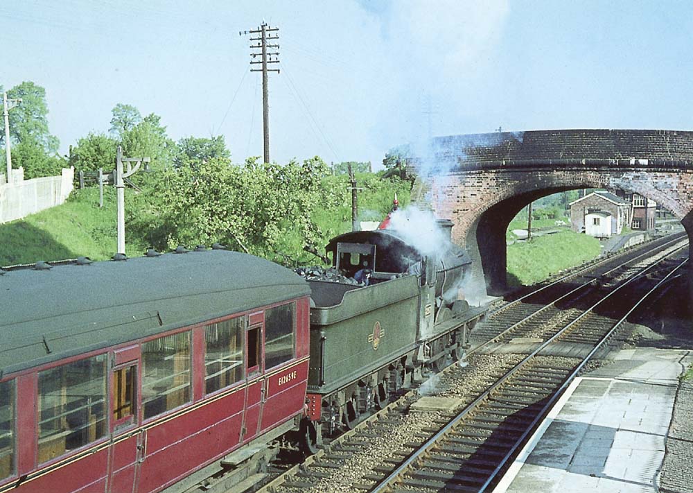 Ex-GWR 0-6-0 2251 class No 3217 is seen passing under Station Road bridge on the 8:43am Stratford upon Avon to Leamington Spa local passenger service