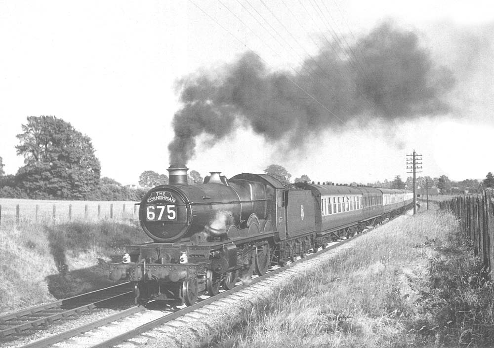 Ex-GWR 4-6-0 Castle class No 5047 'Earl of Dartmouth' is seen at the head of the main portion of the up Cornishman from Penzance to Wolverhampton on 15th June 1957