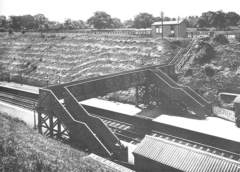 Wood End Platform soon after opening in 1907, showing the original timber footbridge and the prefabricated booking office
