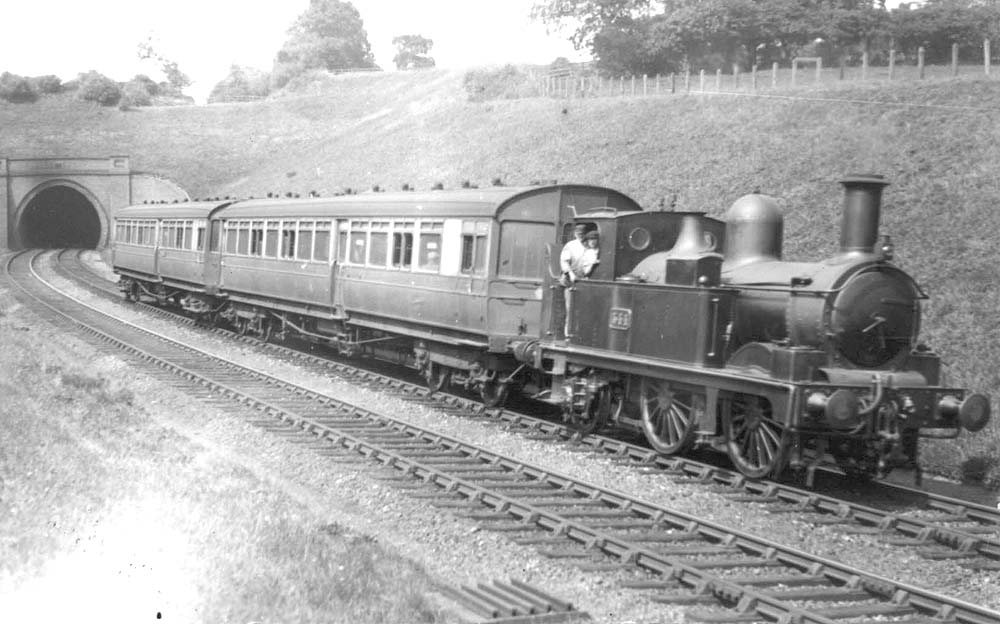 GWR 0-4-2T 517 class No 544 is seen just after leaving Wood End Tunnel at the head of an up Birmingham to Bearley train made up of autocoaches circa 1920