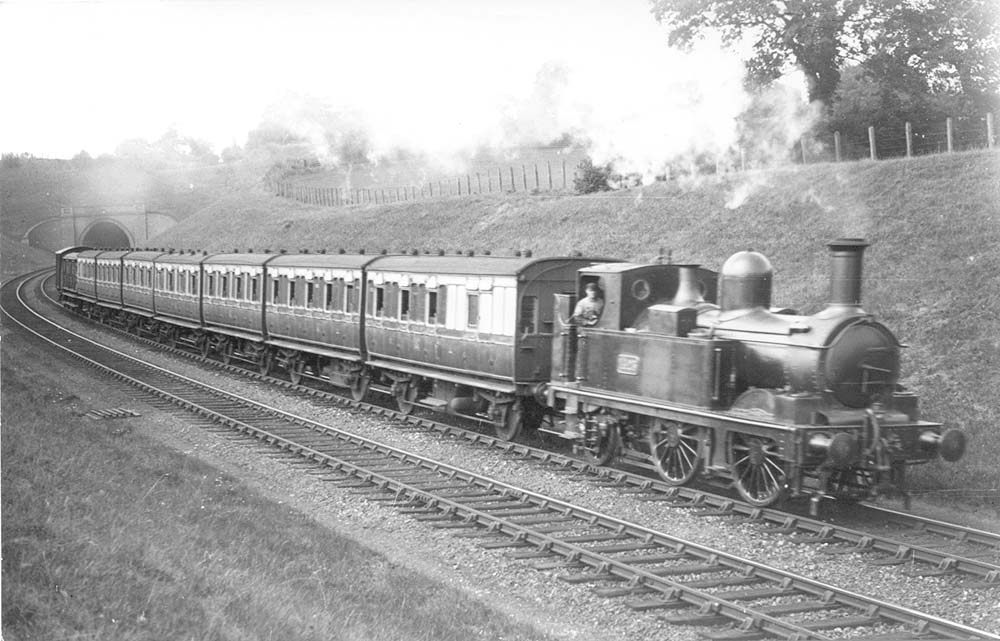 GWR 0-4-2T 517 class No 1425 leaves Wood End Tunnel with a local Birmingham to Stratford upon Avon passenger service