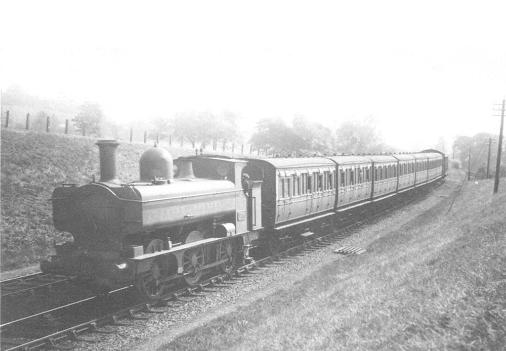 GWR 0-6-0PT 655 class No 1774 approaches Wood End tunnel  with a local passenger service to Birmingham