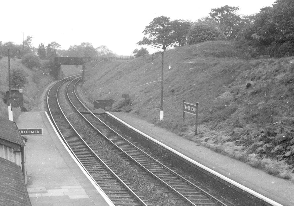 Looking towards Birmingham with the main buildings on the left and Wood End Lane road bridge crossing the line at an oblique angle