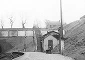 Close up of the buildings on the up platform and the footbridge continuing across to the embankment to steps