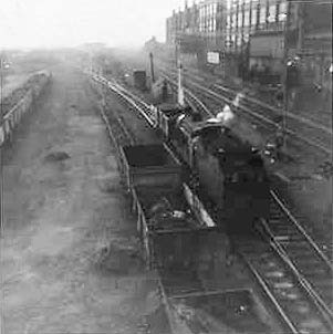 Ex-LMS 2P 4-4-0 No 40690 is seen shunting wagons on the loop line into Adderley Park sidings