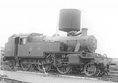 LMS 2-6-2T No 143 stands beneath the parachute water tank near the shed's entrance on 2nd July 1938