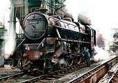 BR built 4-6-0 'Black Five' No 44685 is seen being oiled as it stands beneath the coaling plant on 25th March 1964