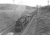 Ex-LMS Class 5 2-6-0 No 42981 is seen approaching the station whilst at the head of a Permanent Way train made up of 'Catfish' wagons