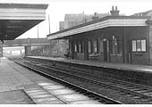 Looking towards Coventry from the Nuneaton end of Bedworth station's up platform with the down platform building on the right