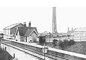 Looking to Nuneaton showing the station's original building on the up platform with the goods yard on the right