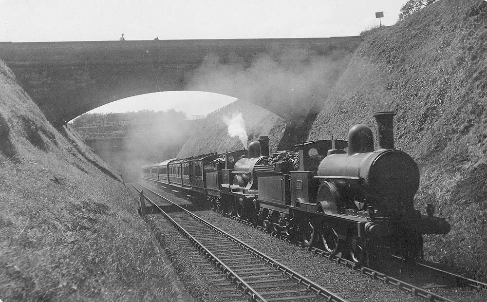 LNWR 2-4-0 No 2190 'Princess Beatrice' and LNWR 2-4-0 No 1924 'Powerful' are seen exiting Beechwood Tunnel