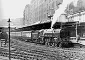 British Railways Standard Class 7 4-6-2 Britannia class No 70031 'Byron' is blowing off steam at the head of the 12 45pm from Manchester London Road