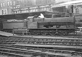 Ex-LNWR 7F 0-8-0 G1 class No 9364 is seen pressed into service to provide motive power for passenger service at the head of an up excursion