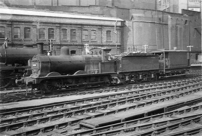 Ex-Midland Railway 2F 0-6-0 No 3168 is seen traversing the down middle road between Platforms 1 and 2 with an ex-Midland  20 ton brake van coupled to its tender