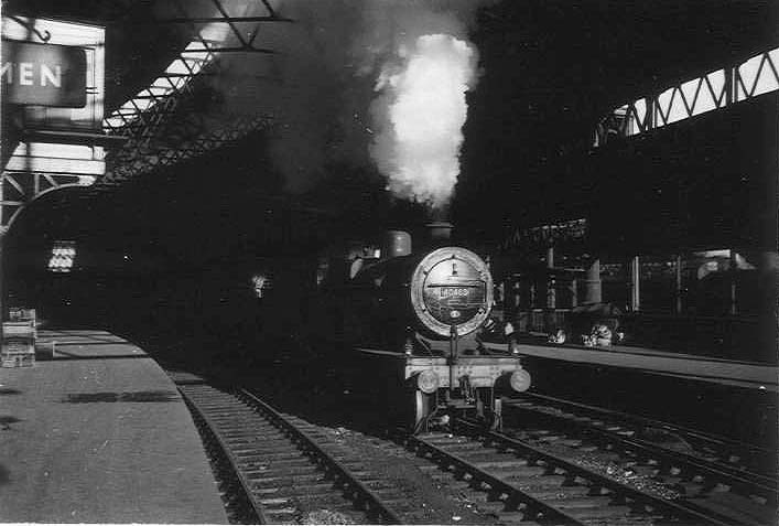 Ex-LMS 5P4F 2-6-0 'Crab' No 2764 is seen passing under Worcester Street bridge with the tunnel seen in the distance, as it enters New Street station