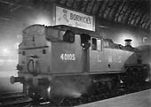 Ex-LMS 3MT 2-6-2T No 40105 is seen passing on the middle road between Platforms 7 and 8 a Class 'J' empty wagon train