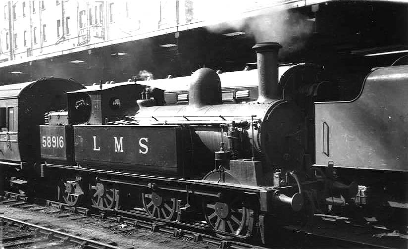 Ex-LNWR 2F 0-6-2T 'Coal Tank' No 58916 is seen shunting coaching stock on the middle road between Platforms 3 and 4 whilst on pilot duties