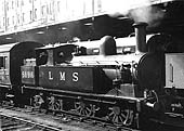 Ex-LNWR 2F 0-6-2T 'Coal Tank' No 58916 is seen shunting coaching stock on the middle road between Platforms 3 and 4 whilst on pilot duties