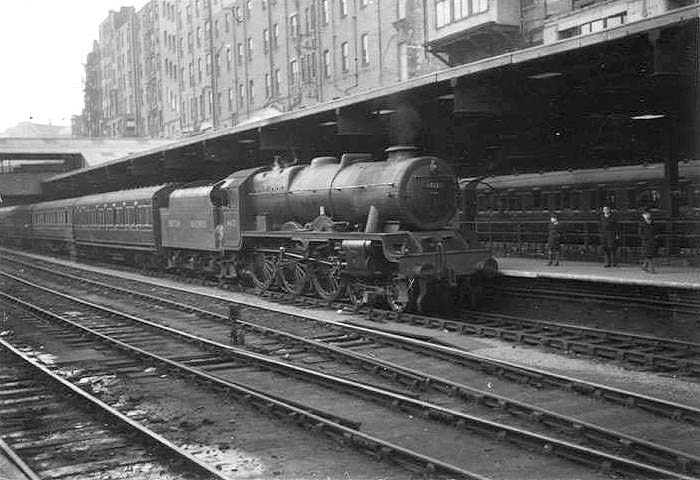 Ex-LMS 7P 4-6-0 'Rebuilt Royal Scot class No 46121 'Highland Light Infantry' is seen arriving at Platform 3 with what was probably a Manchester express