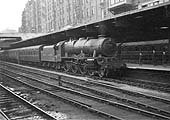 Ex-LMS 7P 4-6-0 'Rebuilt Royal Scot class No 46121 'Highland Light Infantry' is seen arriving with what was probably a Manchester express