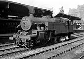 Ex-LMS 4MT 2-6-4T No 42482 is seen standing on the down middle road between Platforms 3 and 4 whilst acting as station pilot