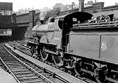 Ex-Midland Railway 2P 4-4-0 No 40443 is seen standing  on the middle road between Platforms 7 and 8 at the West end of New Street