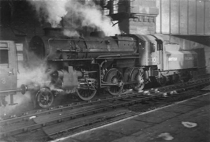 Ex-Midland Railway 2P 4-4-0 No 40443 is seen standing  on the middle road between Platforms 7 and 8 at the West end of New Street