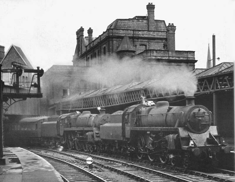 British Railways Standard Class 4 4-6-0 No 75009 pilots British Railways Class 5 4-6-0 No 73016 arrives at Platform 10 on the 8 am service from Newcastle