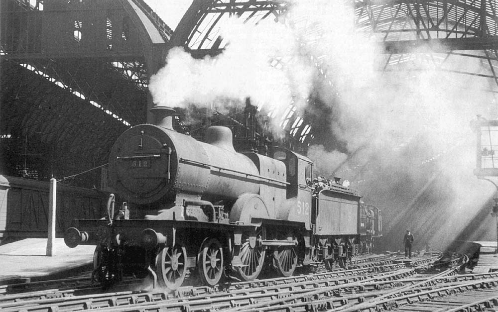 Ex-Midland Railway 2P 4-4-0 No 512 is seen on the middle road between Platforms 9 and 10 whilst acting as station pilot engine